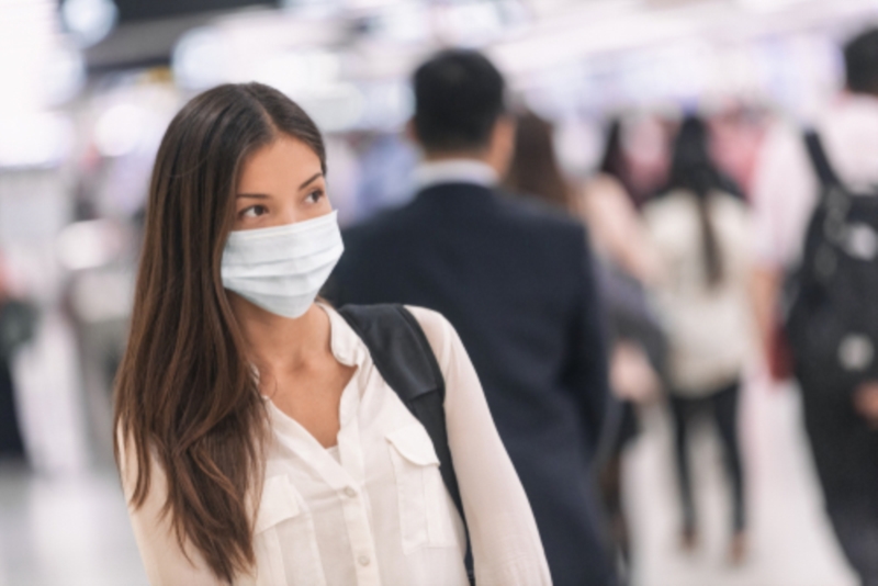 Woman wearing a mask in a store